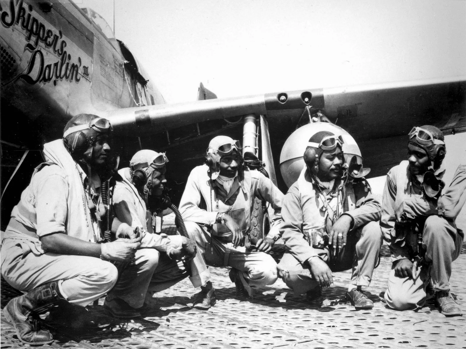 Pilots of the 332nd Fighter Group, "Tuskegee Airmen," the elite, all-African American 332nd Fighter Group at Ramitelli, Italy., from left to right, Lt. Dempsey W. Morgan, Lt. Carroll S. Woods, Lt. Robert H. Nelson, Jr., Capt. Andrew D. Turner, and Lt. Clarence P. Lester. (U.S. Air Force photo)